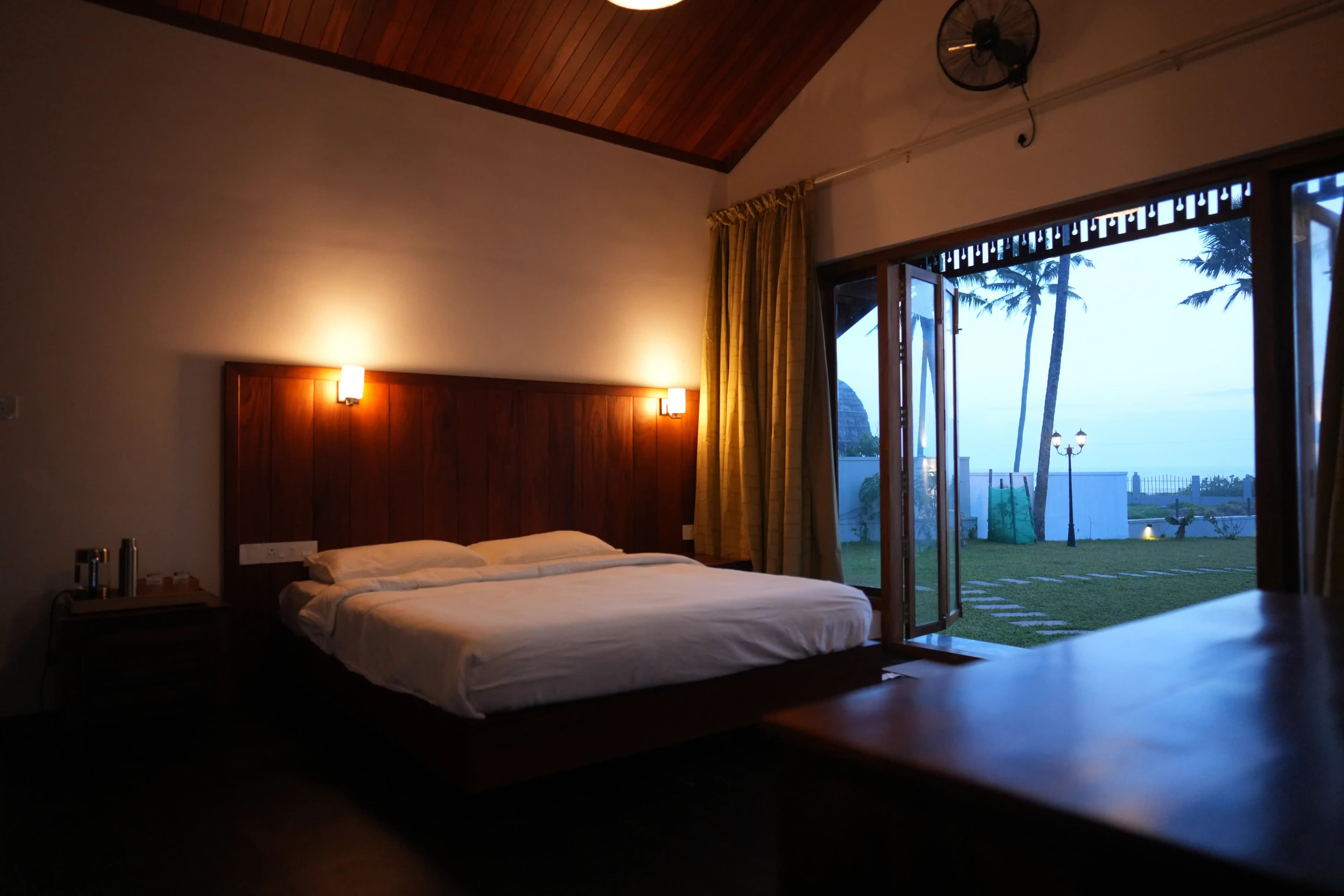 Villa bedroom with open folding doors